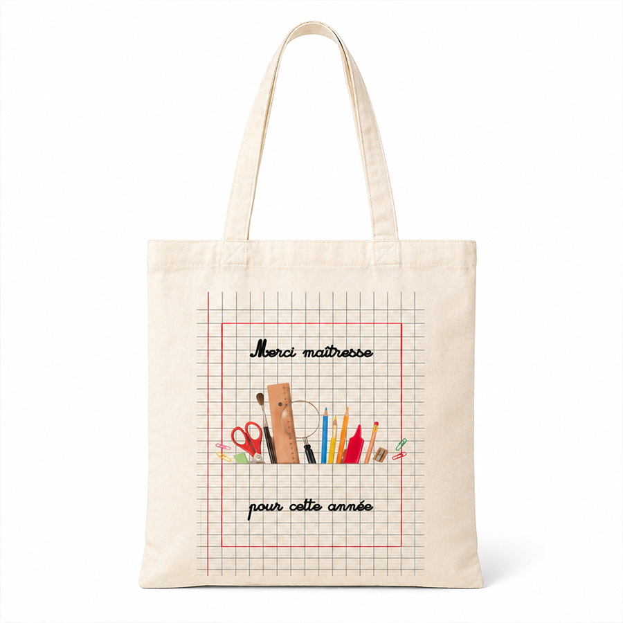 Sac en toile beige affichant des outils scolaires et le texte « Merci maîtresse pour cette année ».